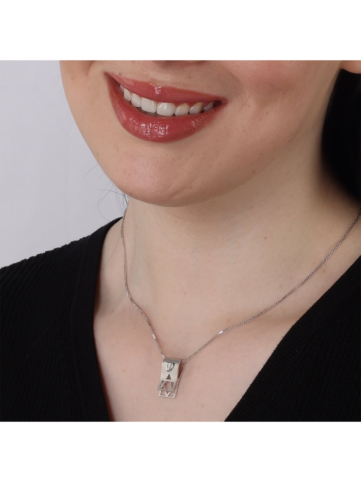 Pendentif en or blanc 14 carats avec tibia et étoile de David découpée
