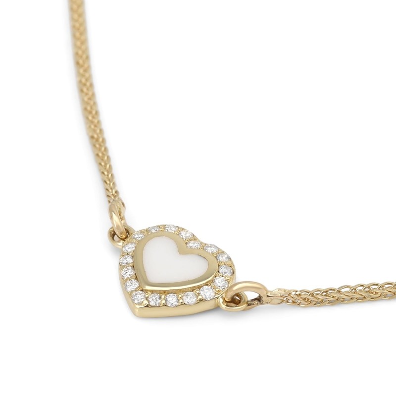 Collier pendentif cœur orné de diamants en or jaune 14 carats