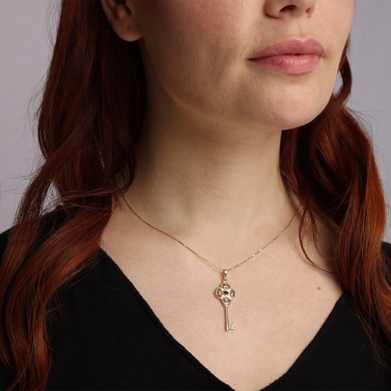 Pendentif clé en or 14 carats avec pierre grenat