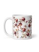 Tasse blanche brillante de grenades séduisantes